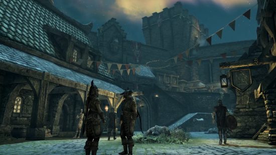 Skyrim console commands and cheats: Guards patrol and converse on a cobbled street within Whiterun at night as festival flags flutter overhead.