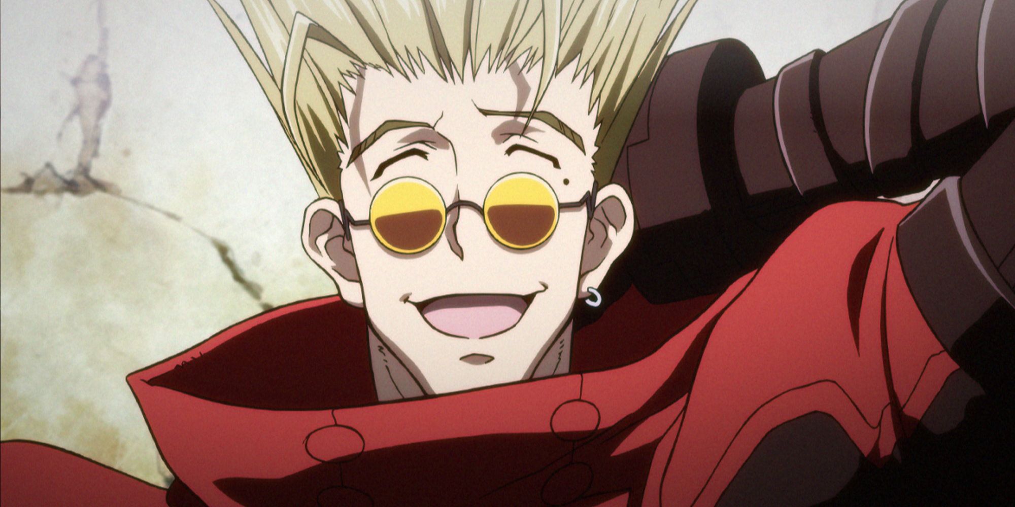 Vash in a red coat and sunglasses laughing.