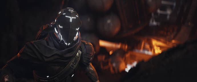 A member of the militia stares at the camera in a black and white suit in EVE: Vanguard. The helmet is slightly illuminated in white light.