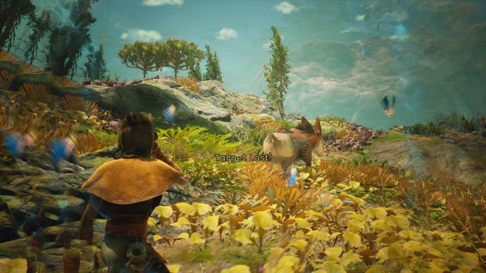 The player stares across a verdant field in Towers of Aghasba