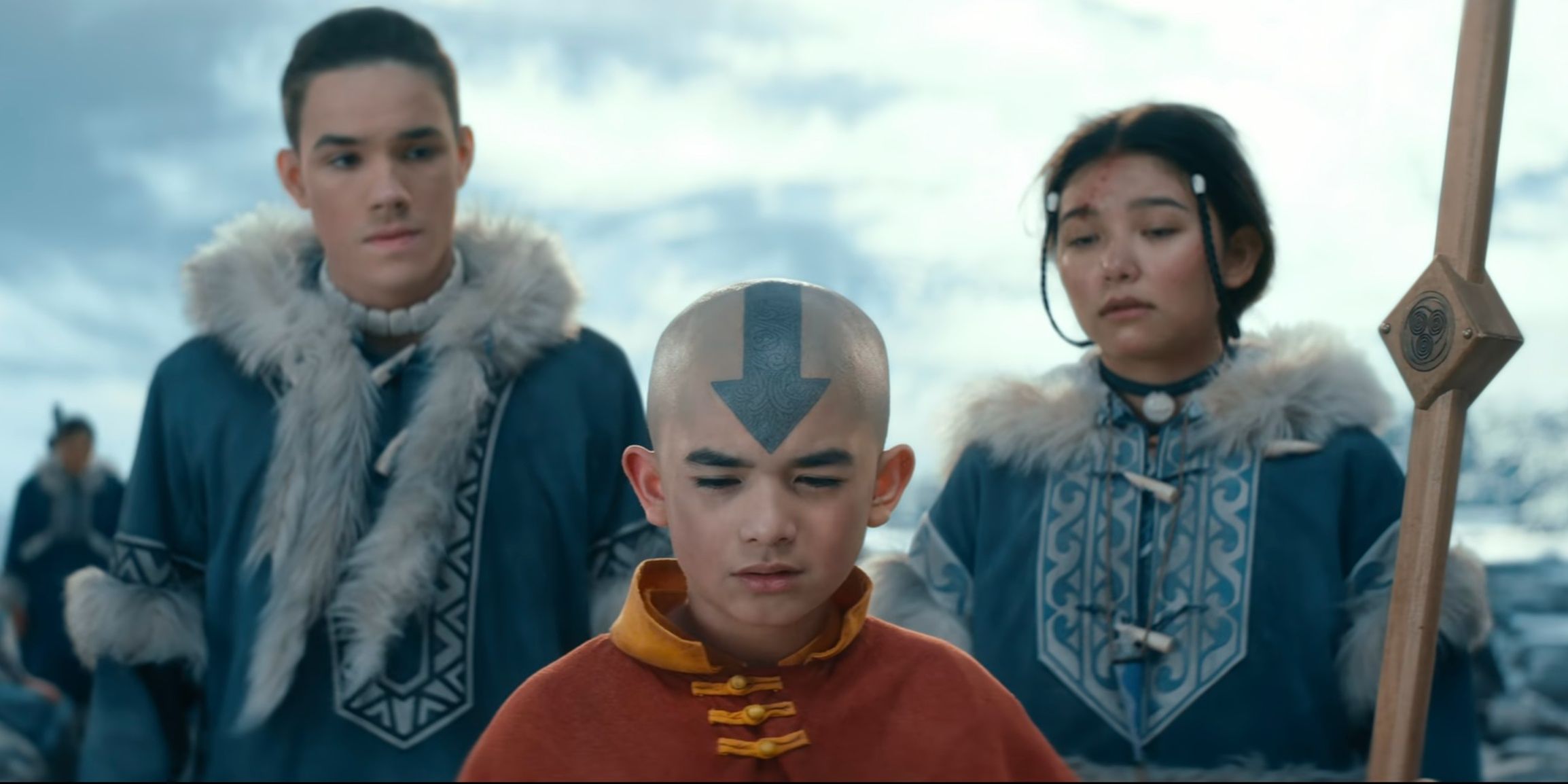 Sokka, Aang, and Katara standing in a line