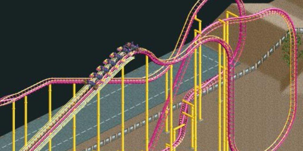 Rollercoaster 2 screenshot of pink an yellow rollercoaster.