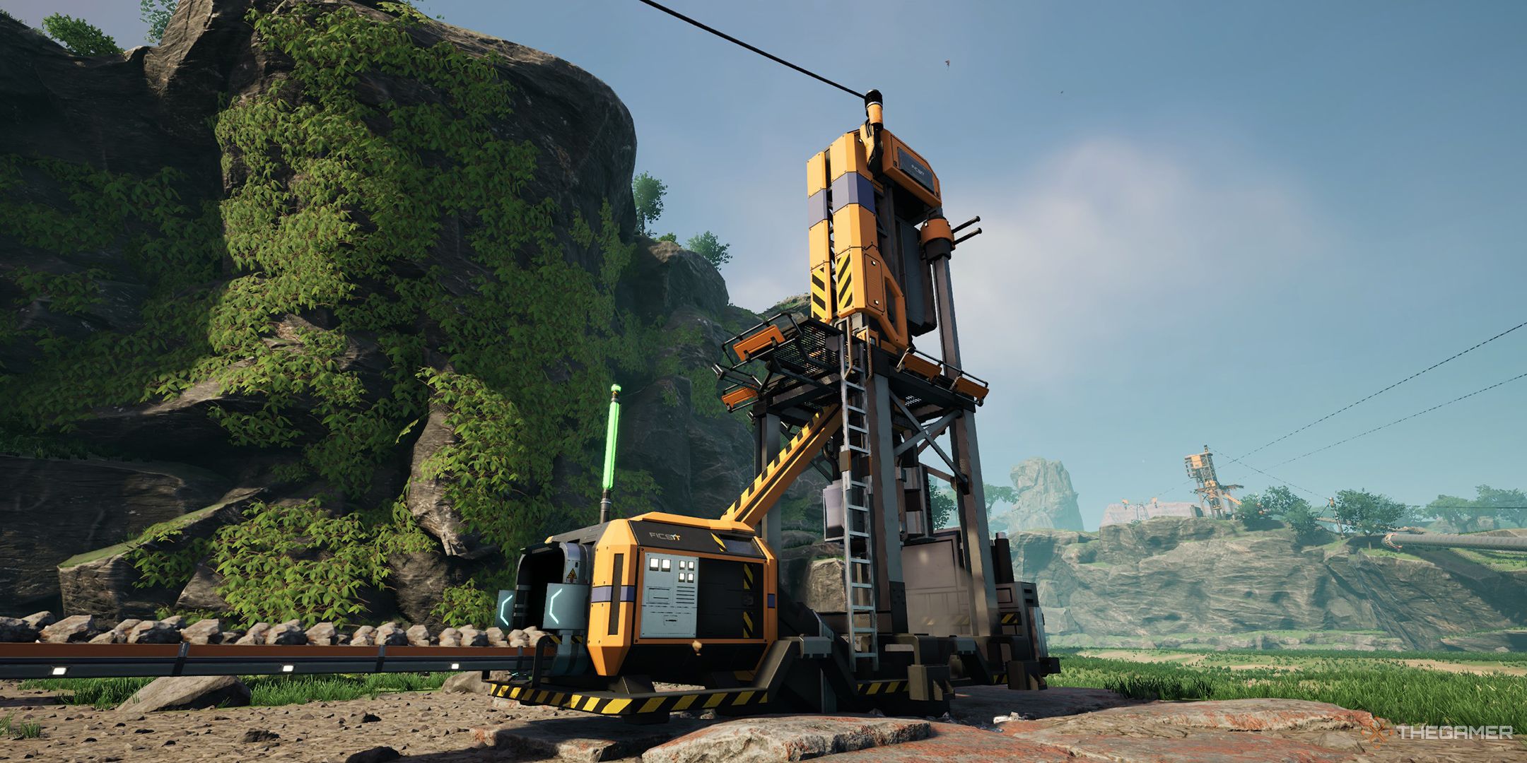 A Miner Mk.2 producing iron ore in front of a mossy rock formation in Satisfactory.