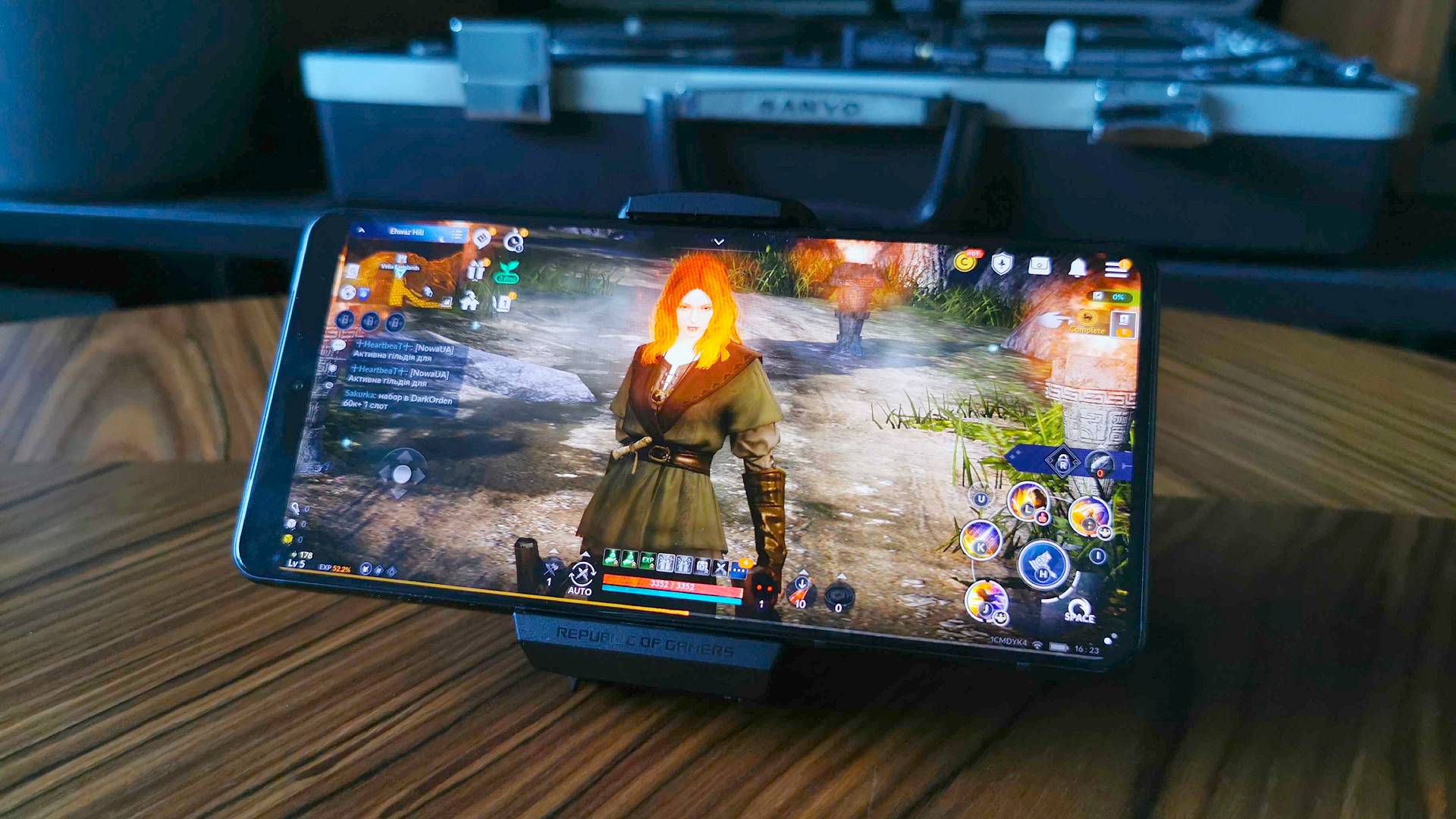 ASUS ROG Phone 8 with Black Desert character on screen