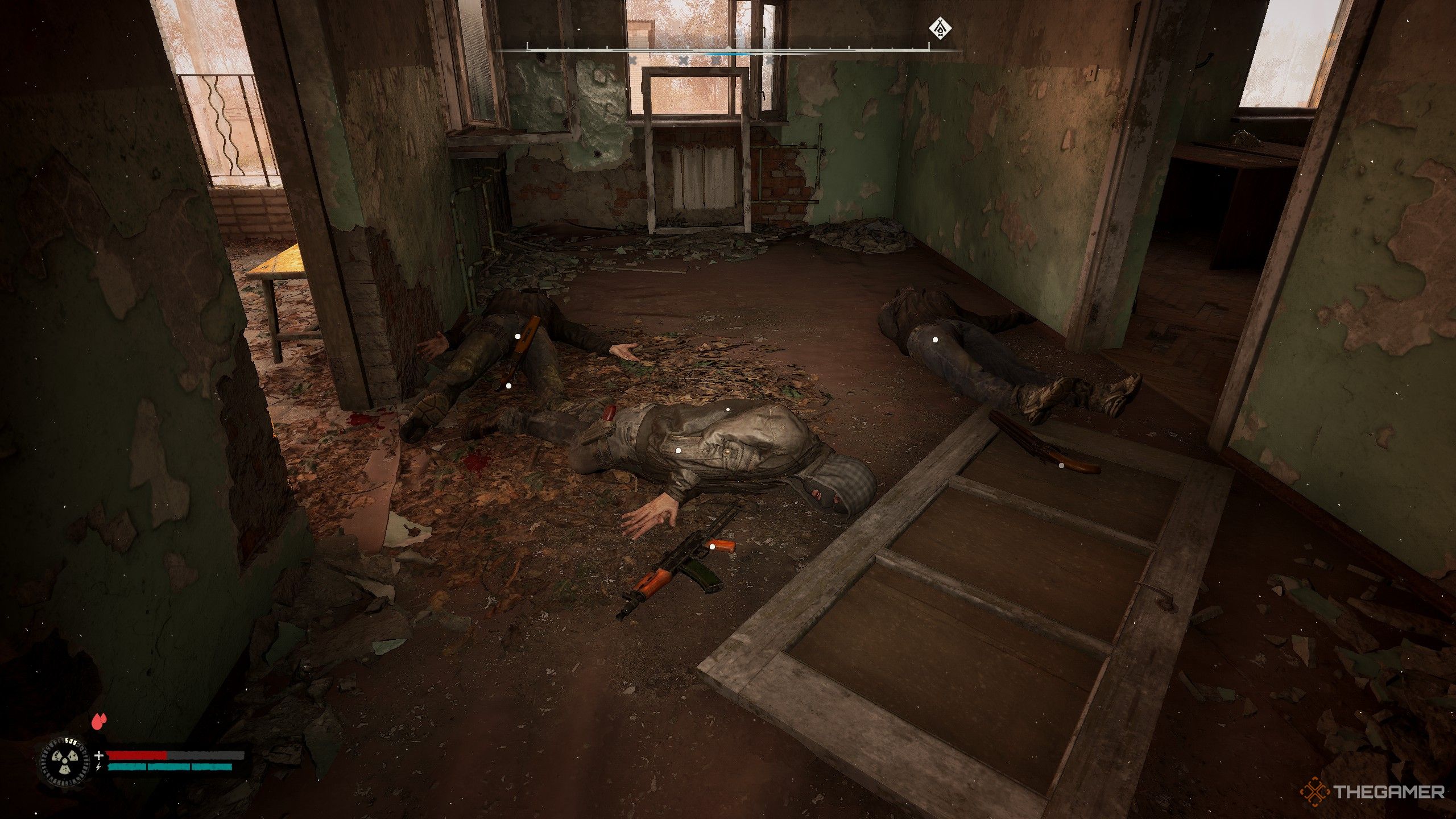 a pile of bodies and weapon in a hallway in Stalker 2 Heart of Chornobyl.