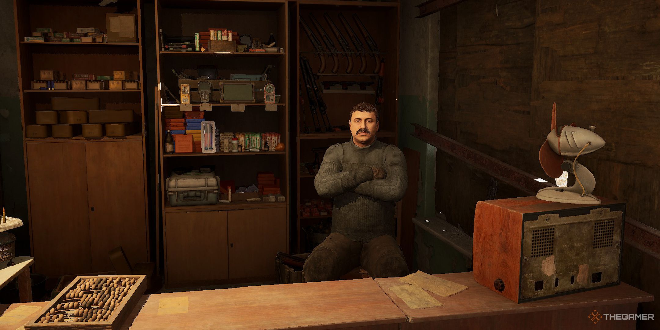 Hamster sitting at his storefront in Stalker 2 Heart of Chornobyl.