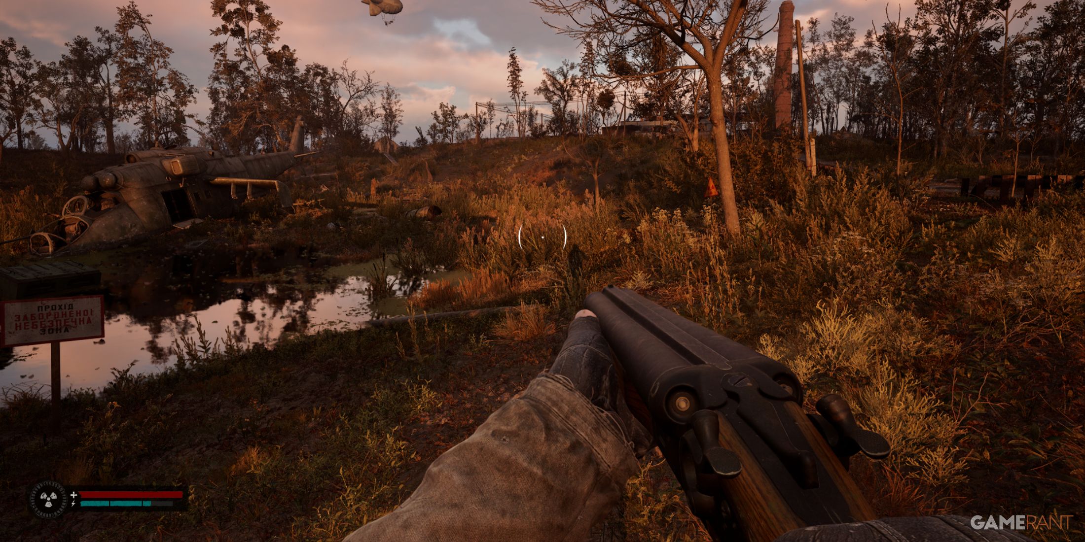 A wrecked helicopter near a swamp, with radiation signs in a desolate environment in STALKER 2