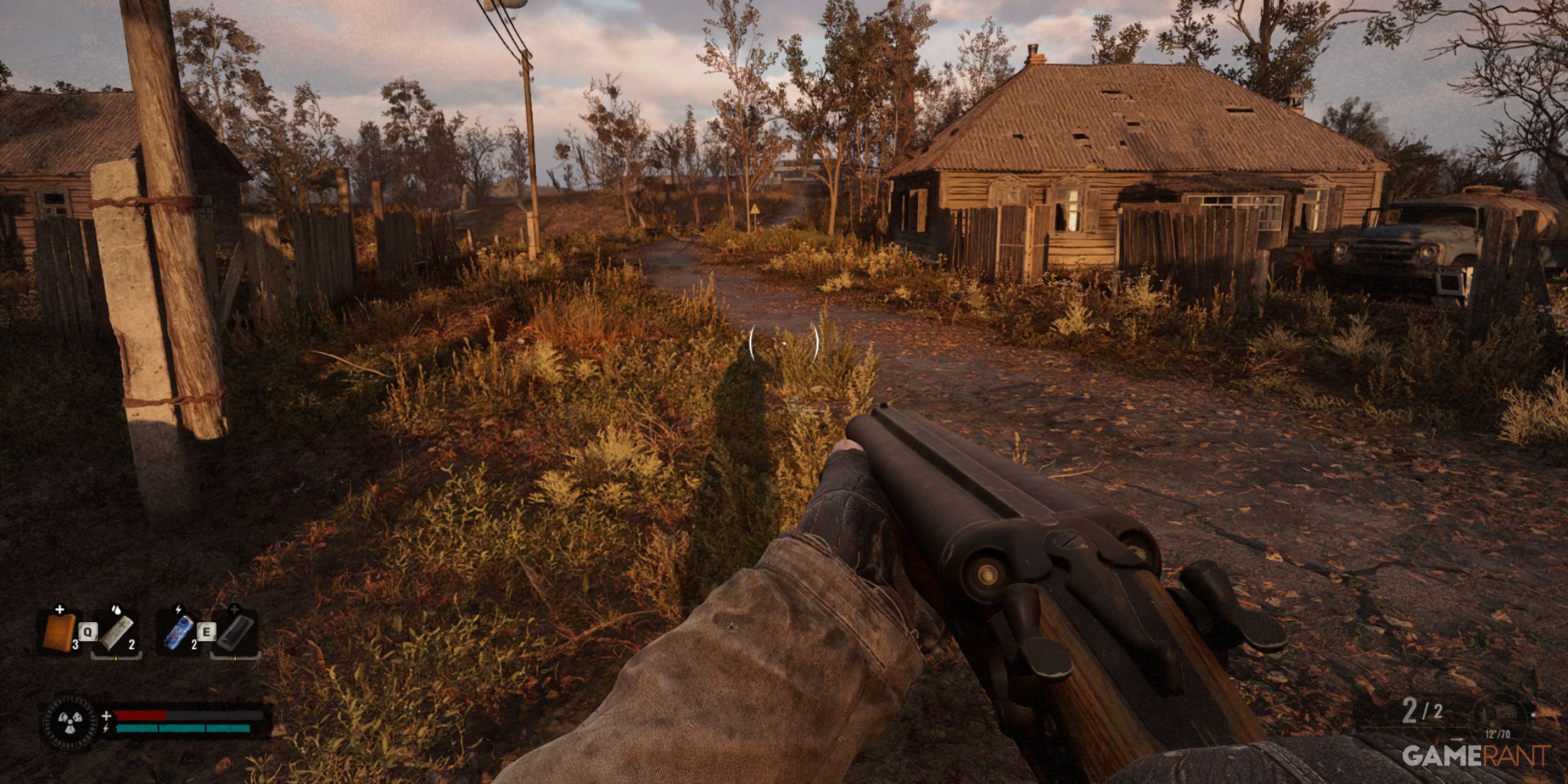 A post-apocalyptic rural road with abandoned wooden houses and a shotgun in hand in STALKER 2