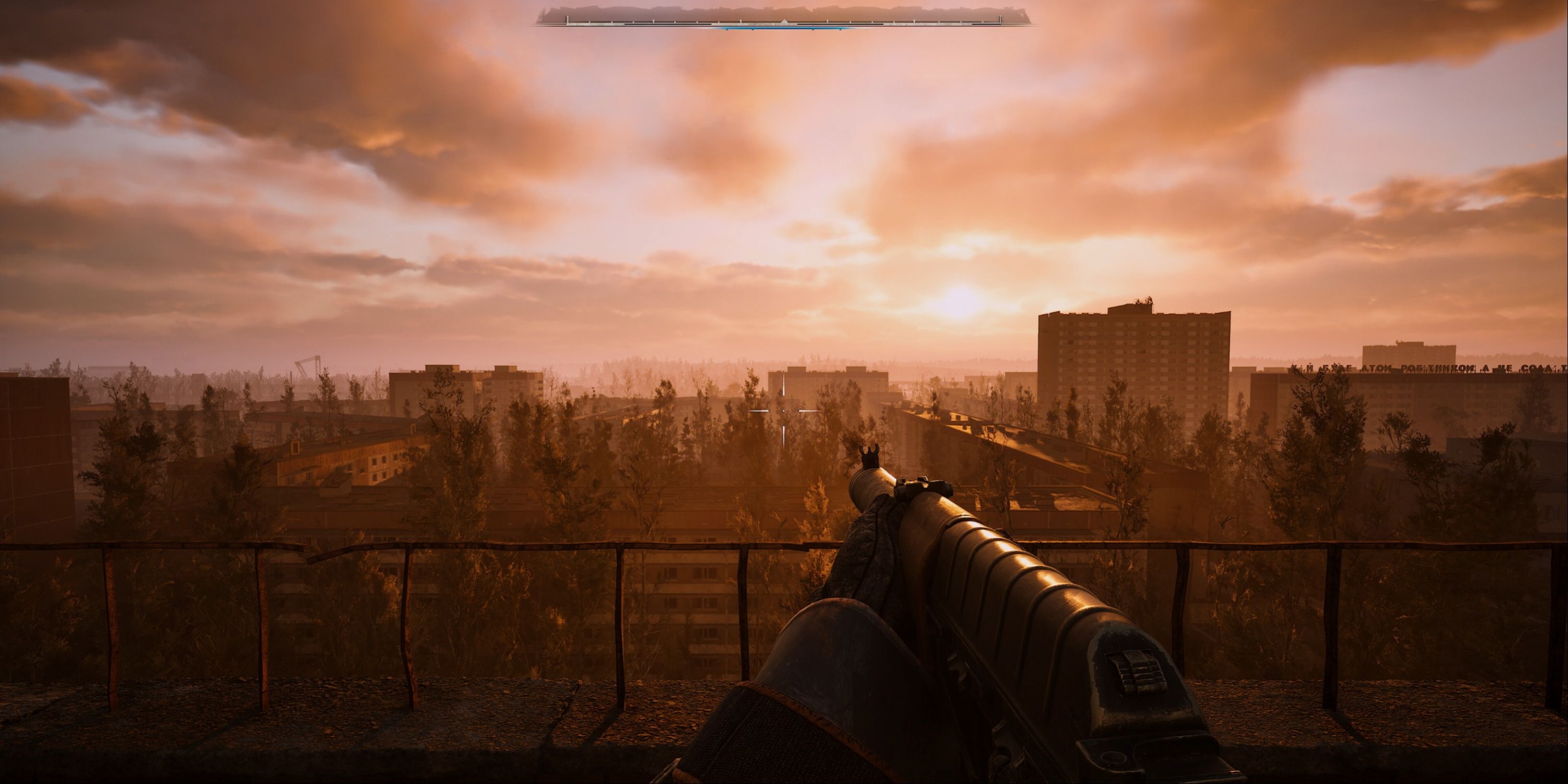 Stalker 2 - The player admiring the view of the city during a rosy sunset.