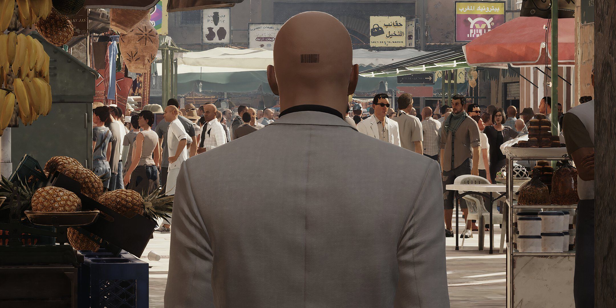 Agent 47 walking towards a crowd. in Hitman