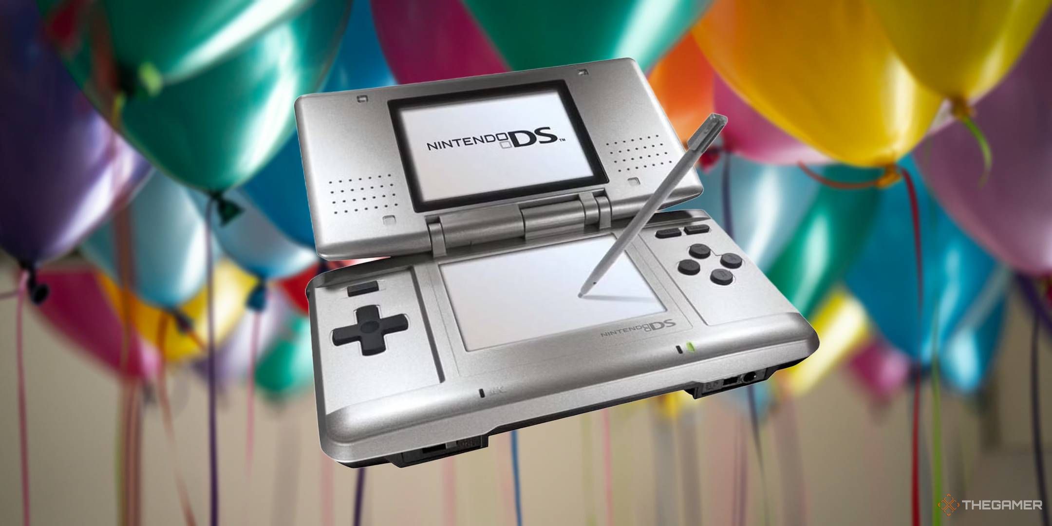 Nintendo DS in front of party balloons