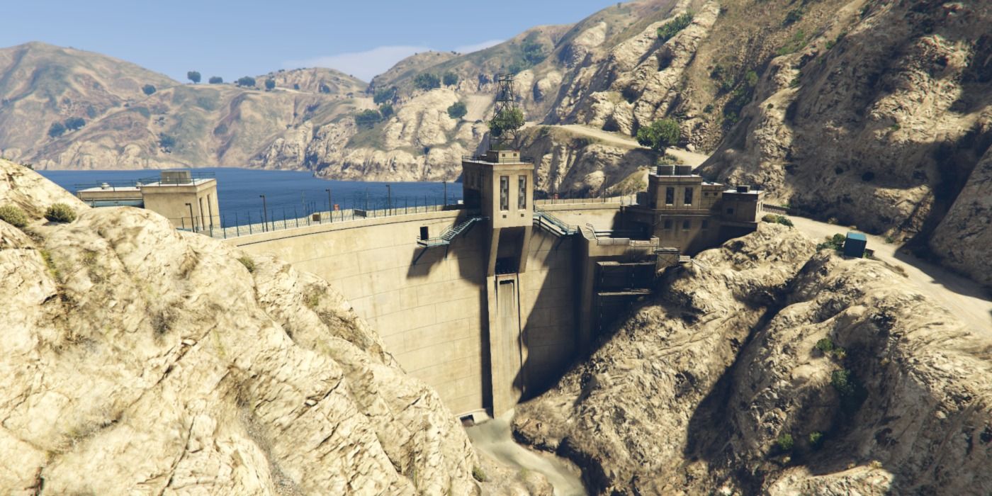 A huge water dam in the rocky hills of Grand Theft Auto 5.