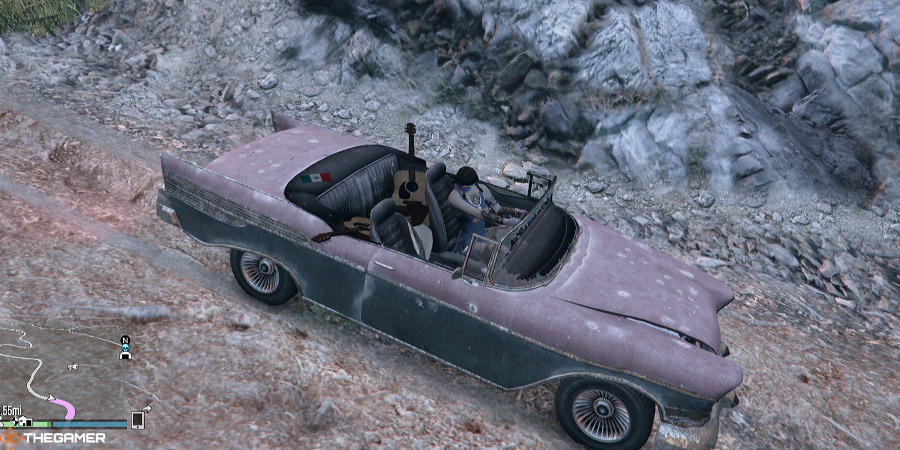 A beat up convertible in a rocky valley in Grand Theft Auto 5.