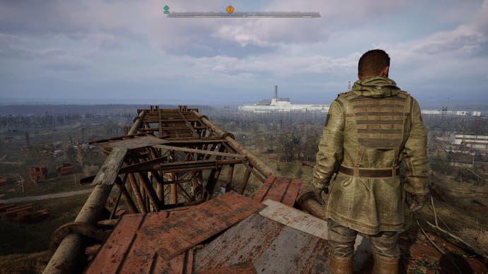 Fellow Stalker Richter looks out over the countryside from the top of a crane in Stalker 2: Heart of Chornobyl.