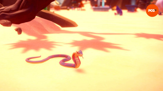 A blue cobra lies on the ground of the desert in Dreamlight Valley.