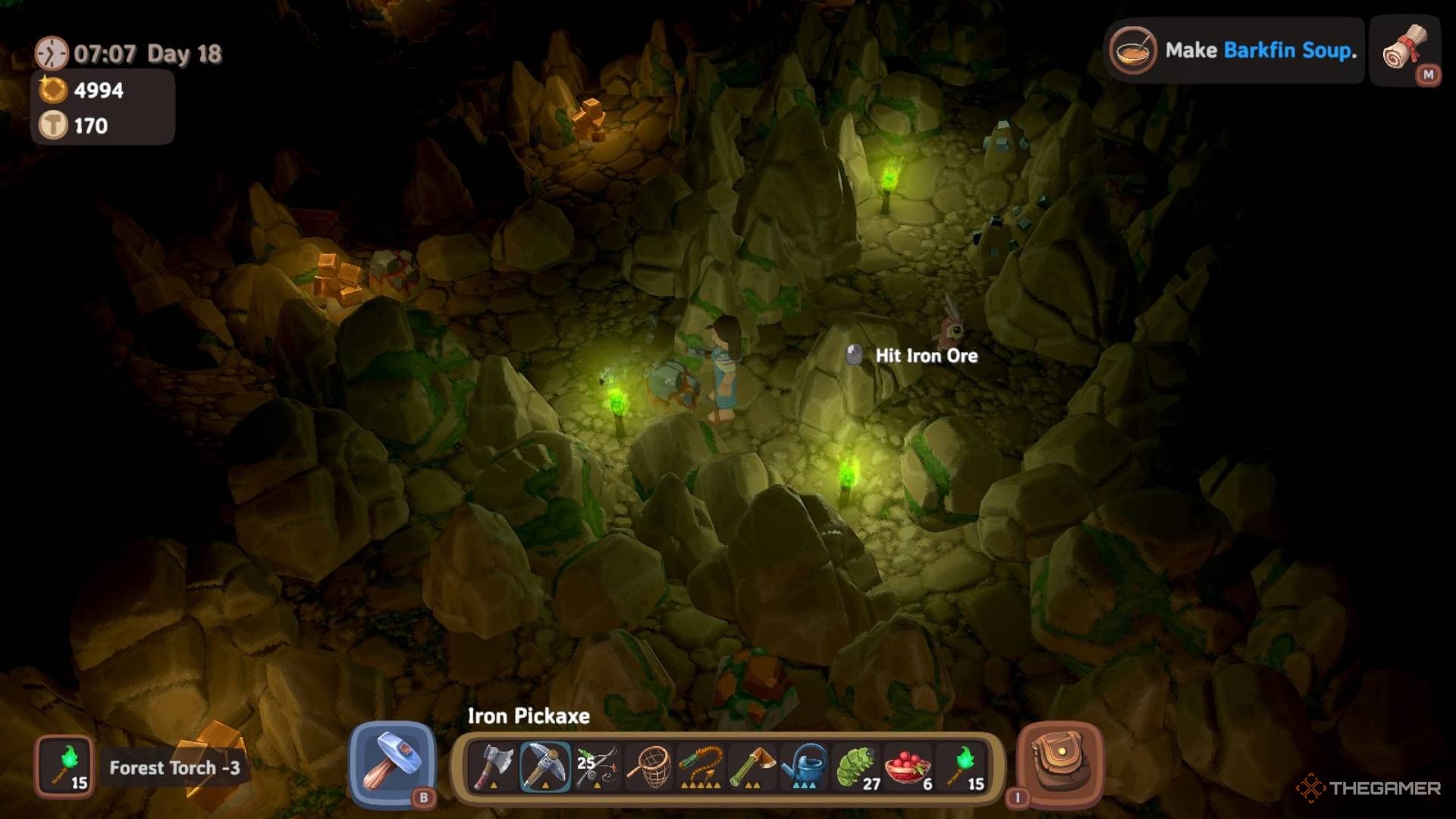 Player character standing by a piece of Iron Ore in the Lost Forest Caves in Luma Island.