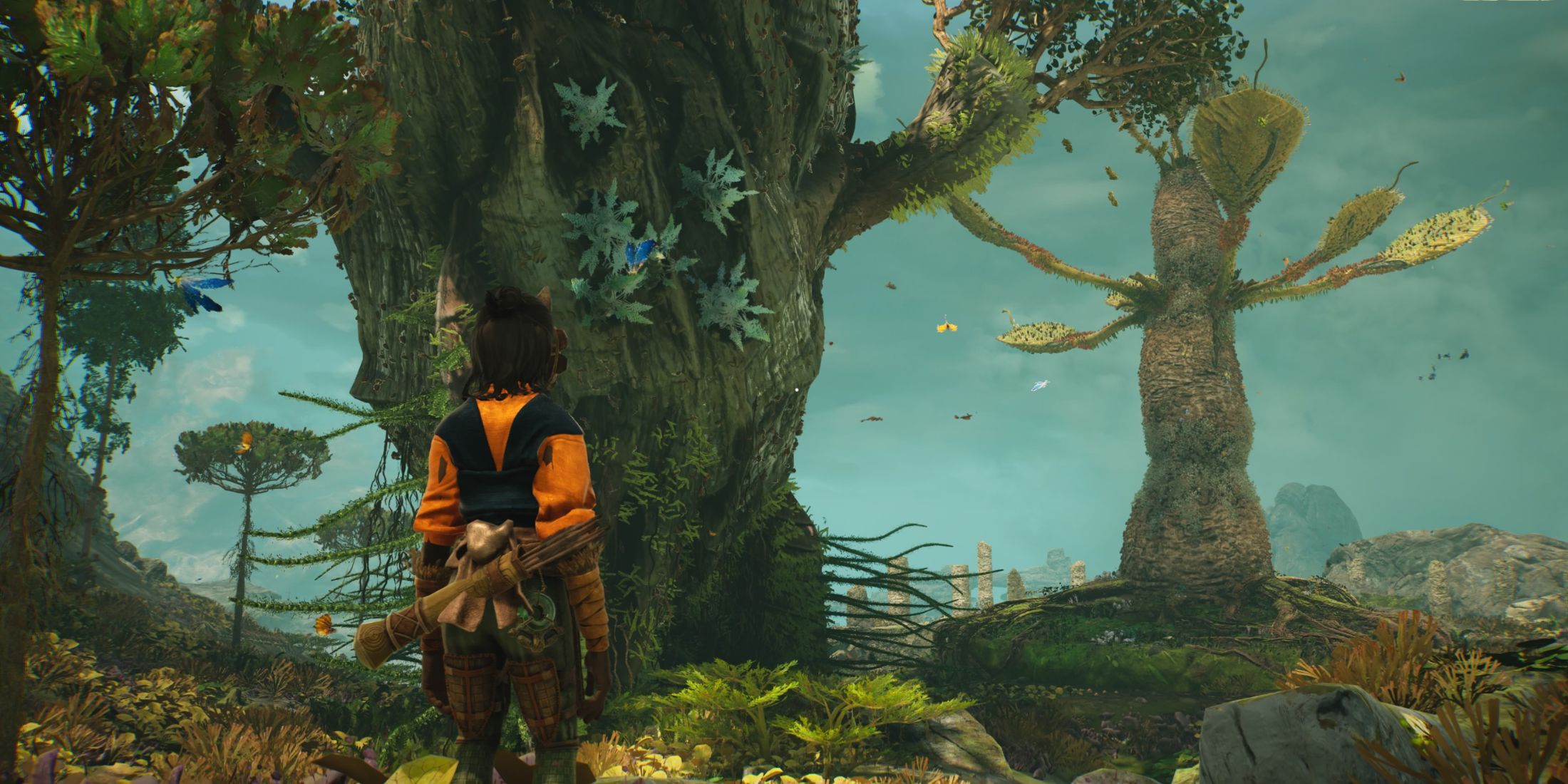 A player standing in front of two huge trees in Towers of Aghasba