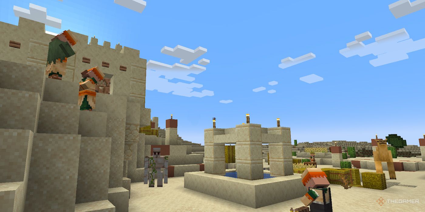 Multiple Minecraft villagers gather around a desert village's well.