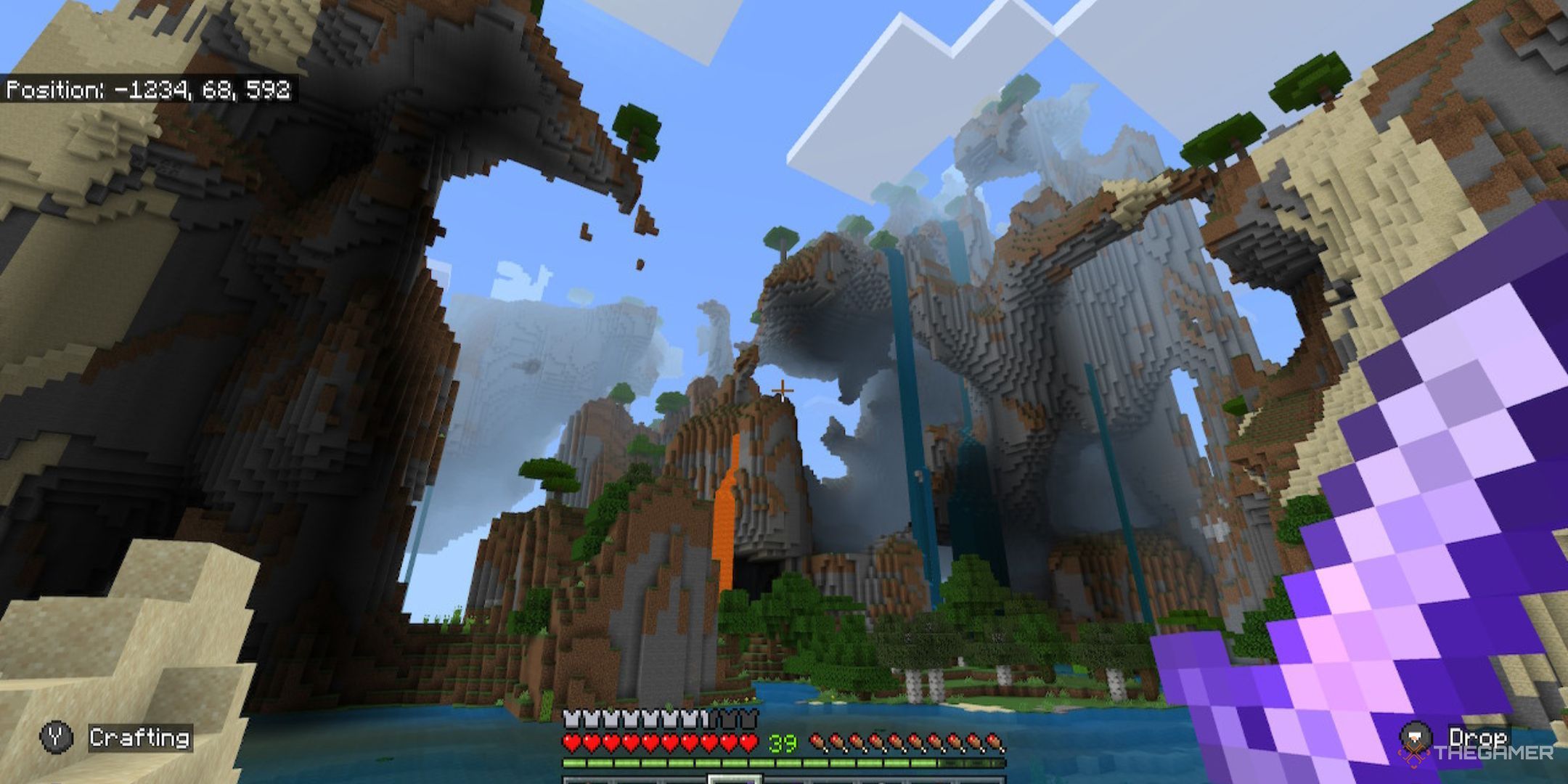 Minecraft scenery showcasing water, lava, and cliffsides, featuring an enchanted purple diamond sword.