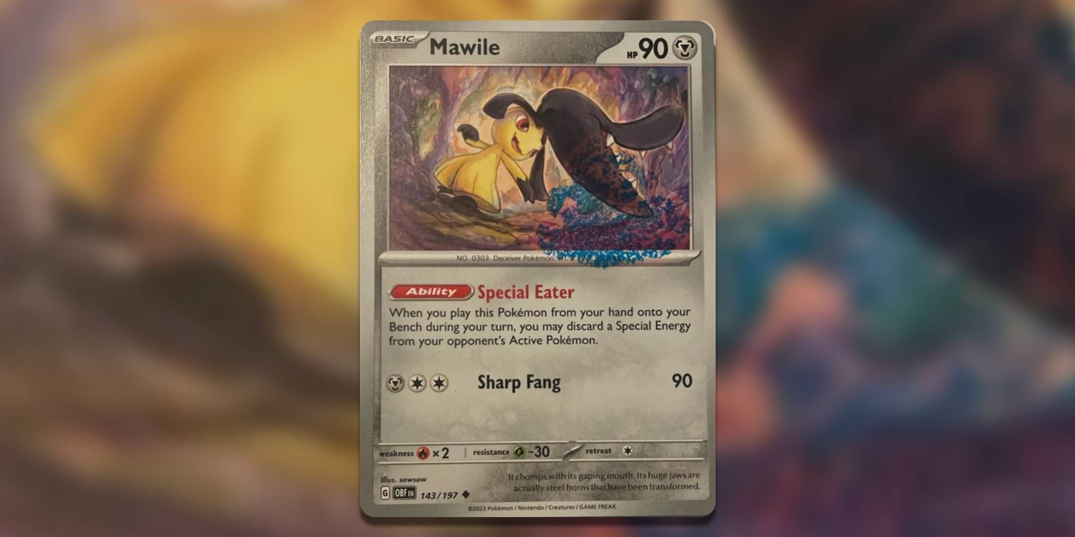 The Pokemon TCG Mawile with blue ink stain.