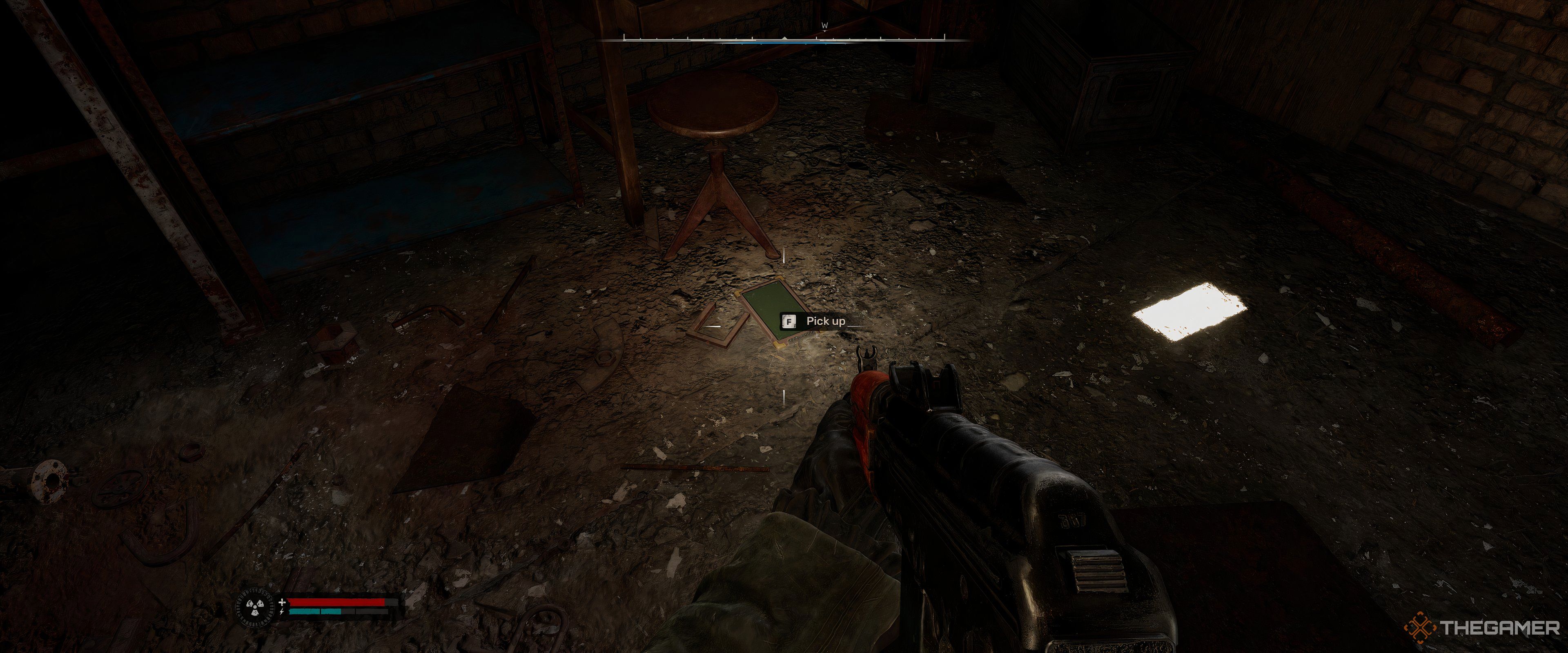 A PDA on the ground in a shack in Stalker 2: Heart of Chornobyl.