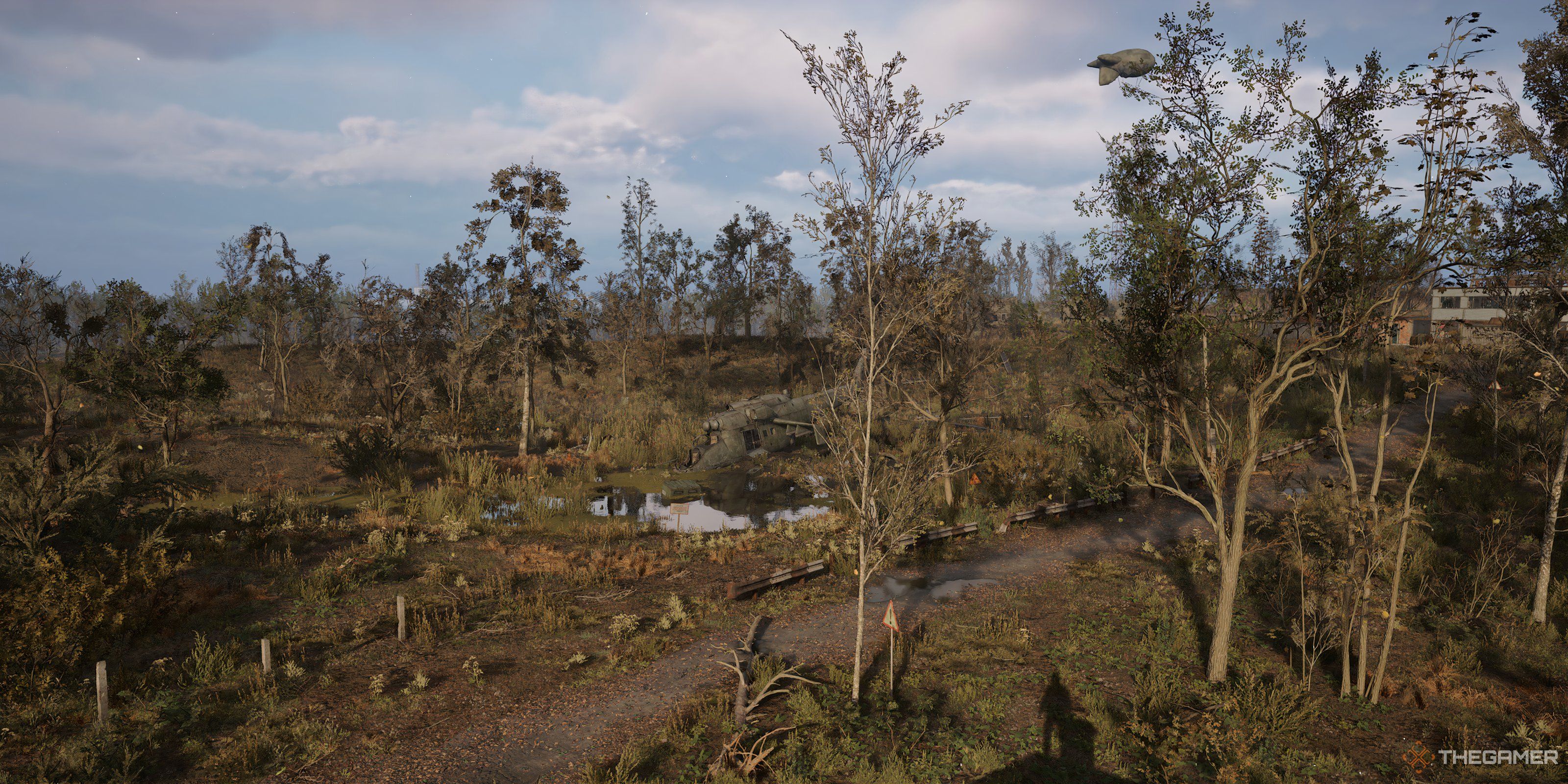 A field with helicopter in Stalker 2: Heart of Chornobyl.