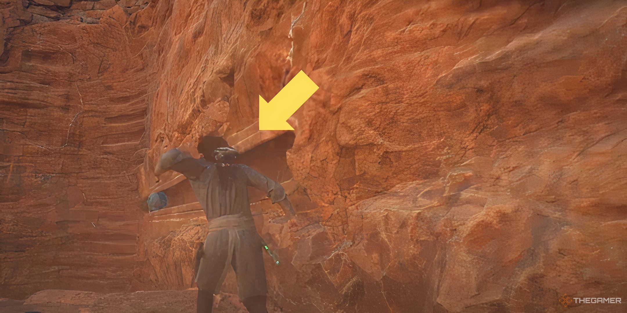 In Star Wars: Jedi Survivor, Cal Kestis force pulls an orb toward himself during a puzzle. A yellow arrow highlights the orb.