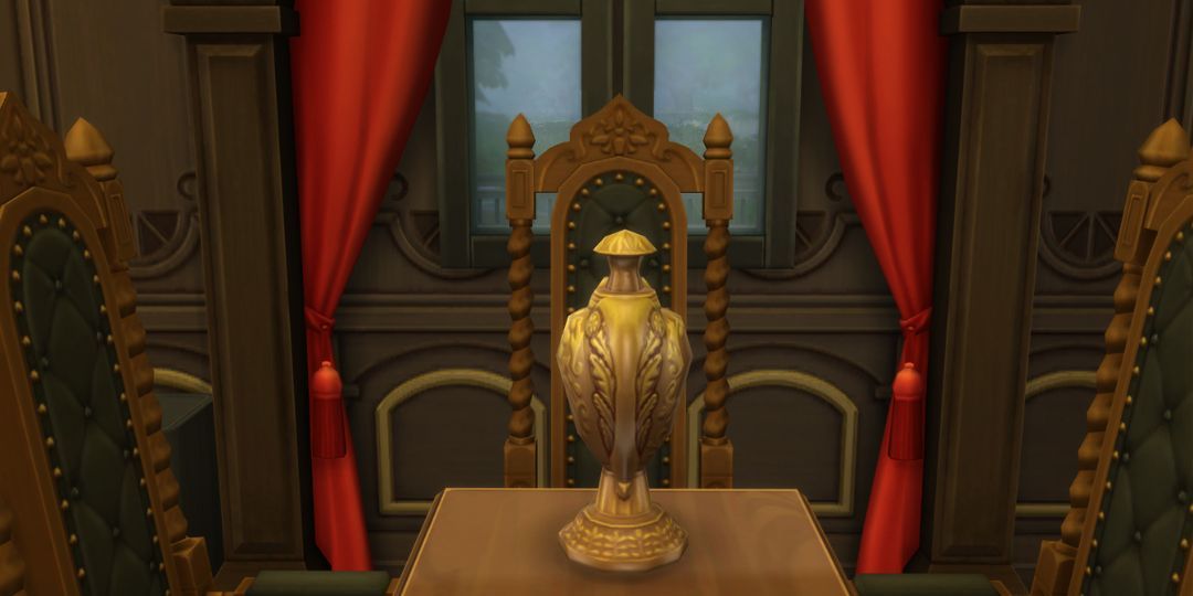 The Winged Urn from the Sims 4. It is a golden urn with a wing motif.