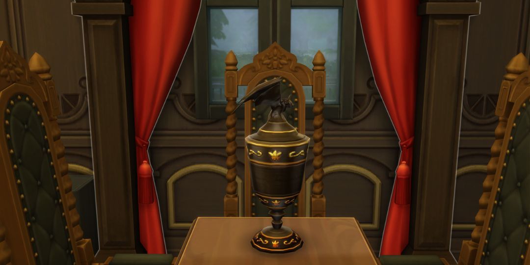 The vampire urn from the Sims 4. It is made of black metal and has a bat on the lid.