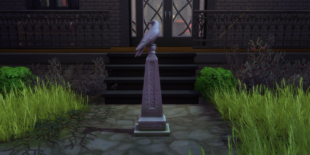 A grave stands with a raven on the top.