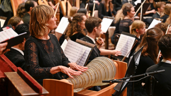 Christa Schönfeldinger looks attentively towards Vijay Upadhyaya for her cue to begin her solo on glass harmonica as part of the Impact4Music: Diversity in Harmony benefit concert.