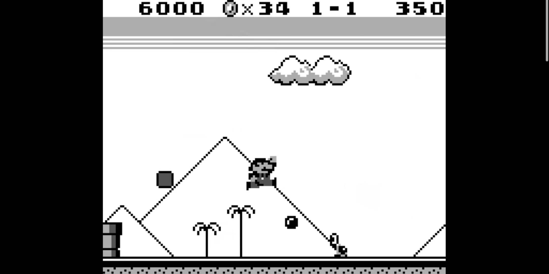 Mario shooting a superball at an enemy in Super Mario Land.