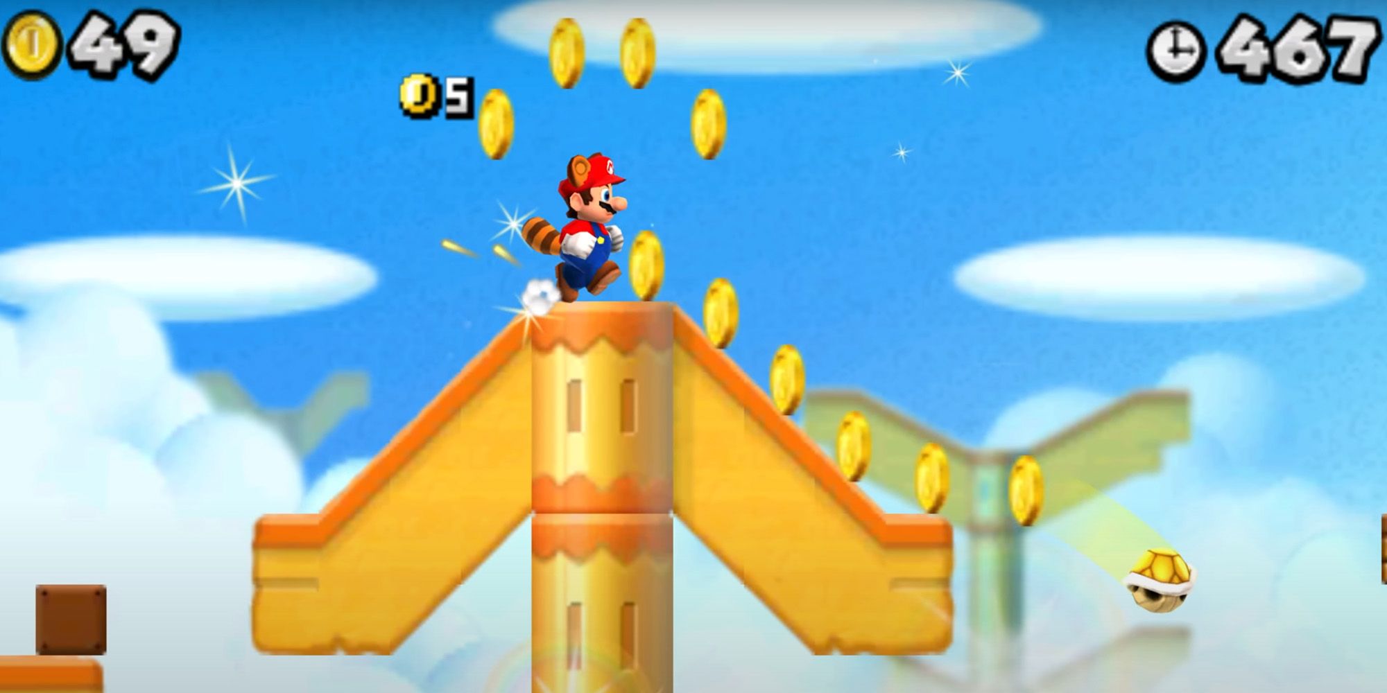 New Super Mario Bros. 2 - Raccoon Mario kicking a Koopa shell and collecting coins.