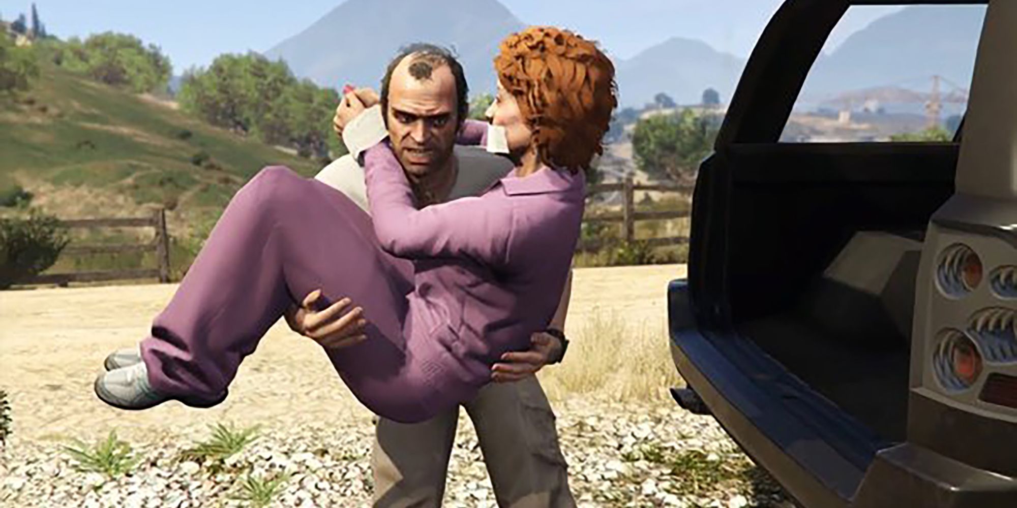 Trevor carrying Patricia behind a car in GTA 5