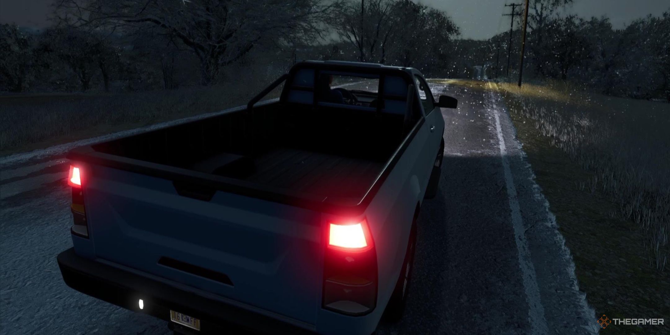 A truck drives through a winter snowfall in Farming Simulator 25.