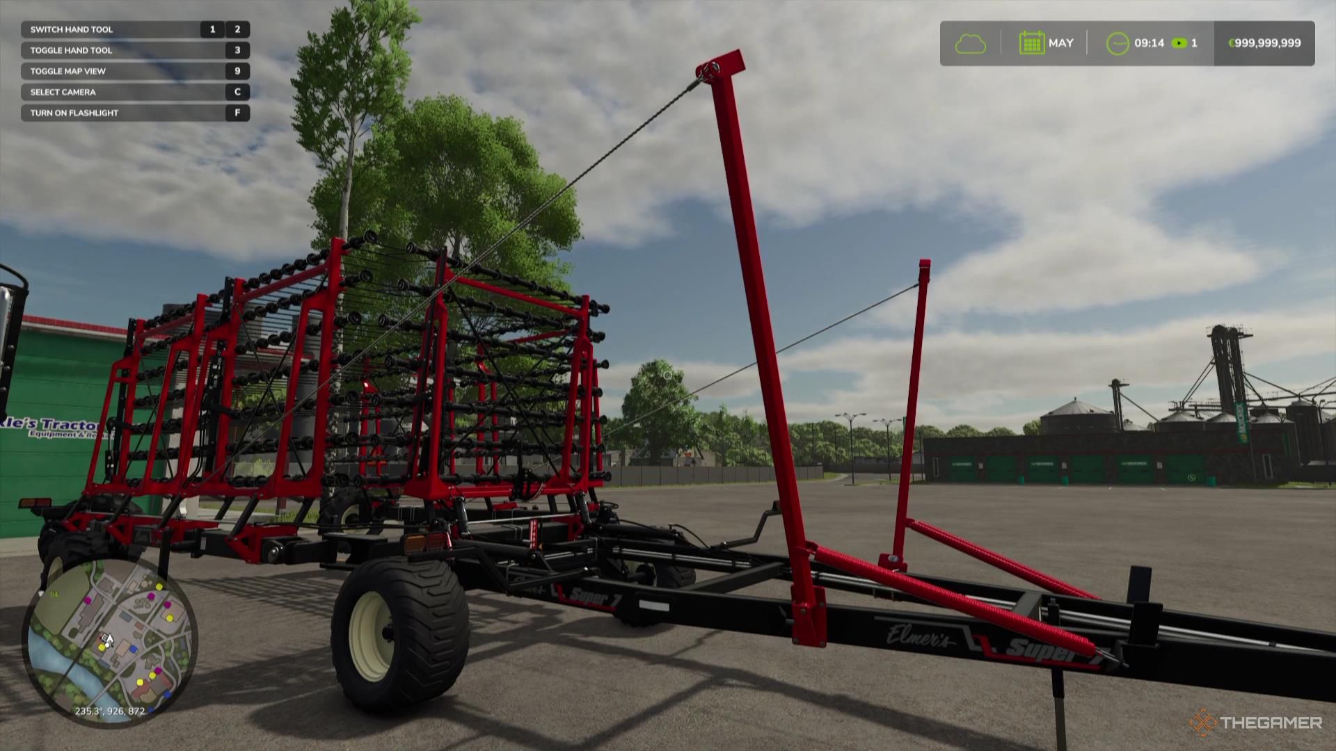 A large weeder sits in a parking lot in Farming Simulator 25.