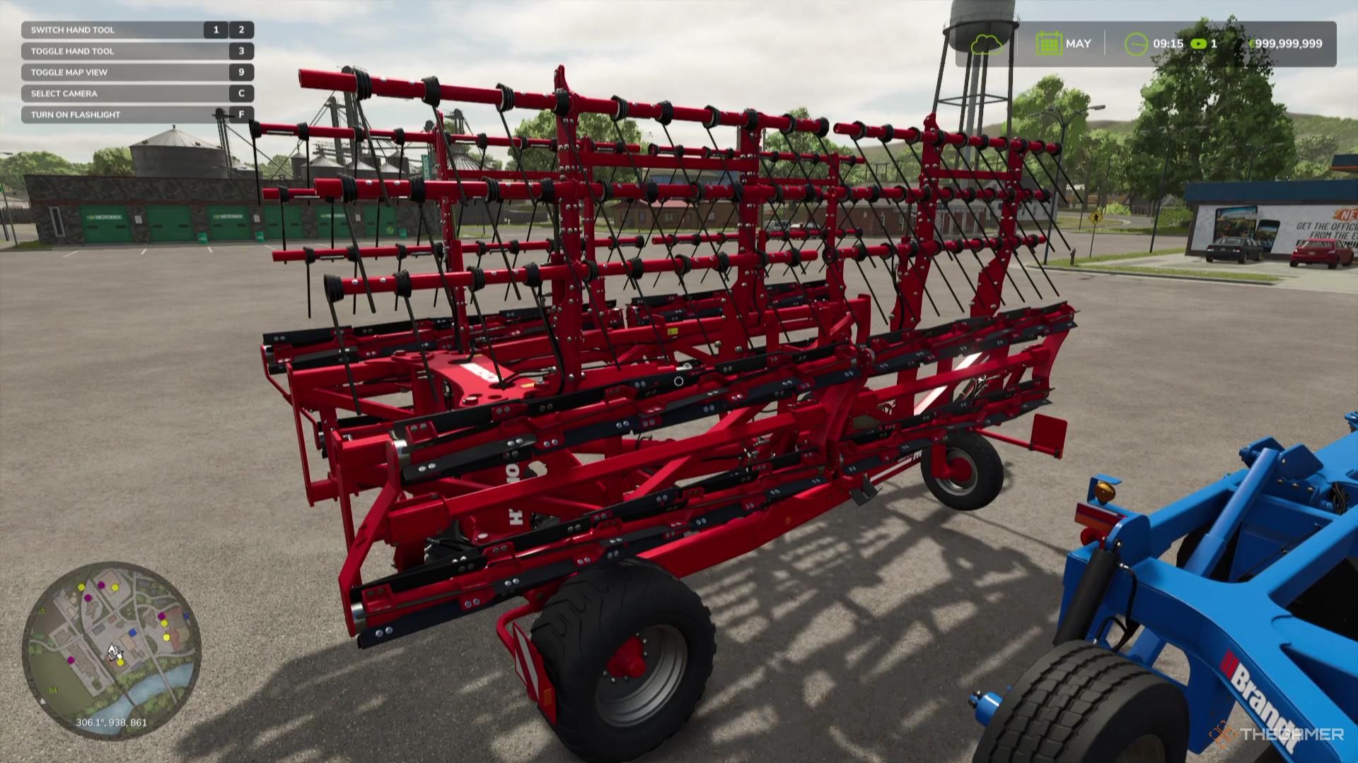 A mulcher sits in a parking lot in Farming Simulator 25.