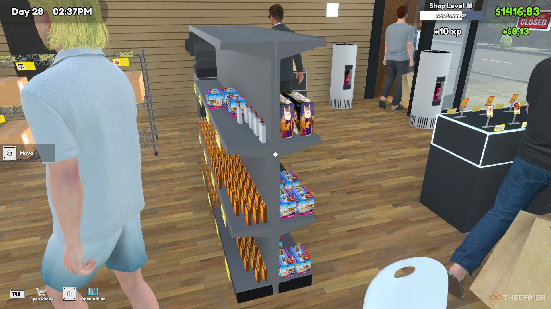 The player is standing in front of a double sided shelf in TCG Card Shop Simulator.