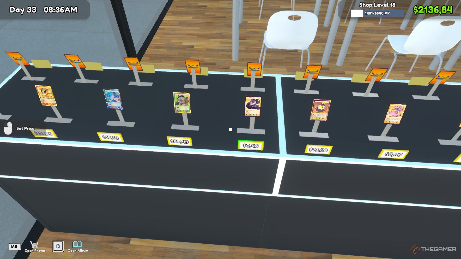 The player is standing in front of the card display tables in TCG Card Shop Simulator.