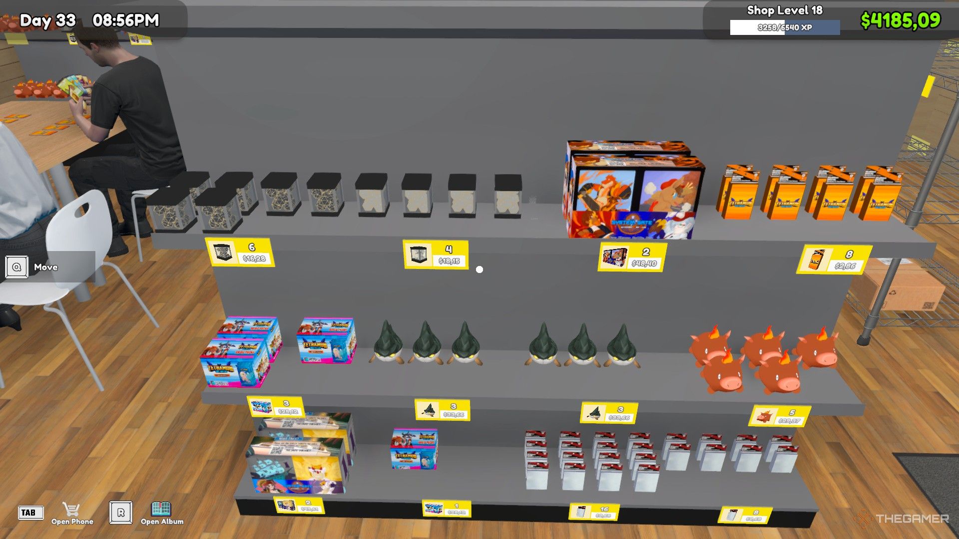 The shelf contains booster packs, card boxes, sleeves and plushies in TCG Card Shop Simulator.