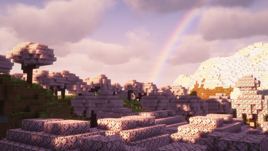 A pink sky and a rainbow over a cherry grove biome thanks to one of the best Minecraft shaders, Complementary.