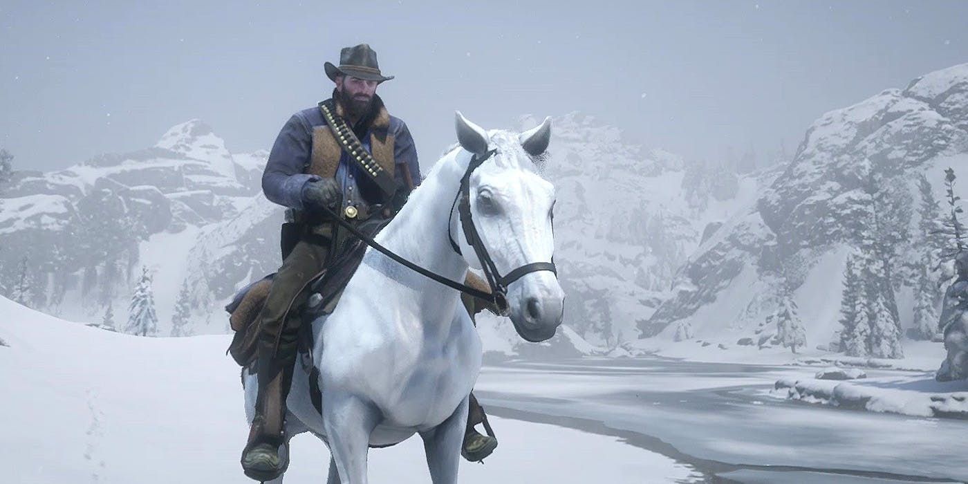 Arthur riding a White Arabian horse through the snow in Red Dead Redemption 2.