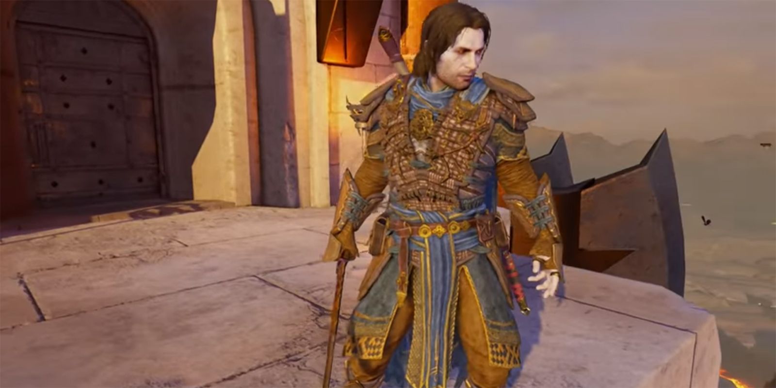 Talion standing atop a tower, wearing the Marauder Legendary set.