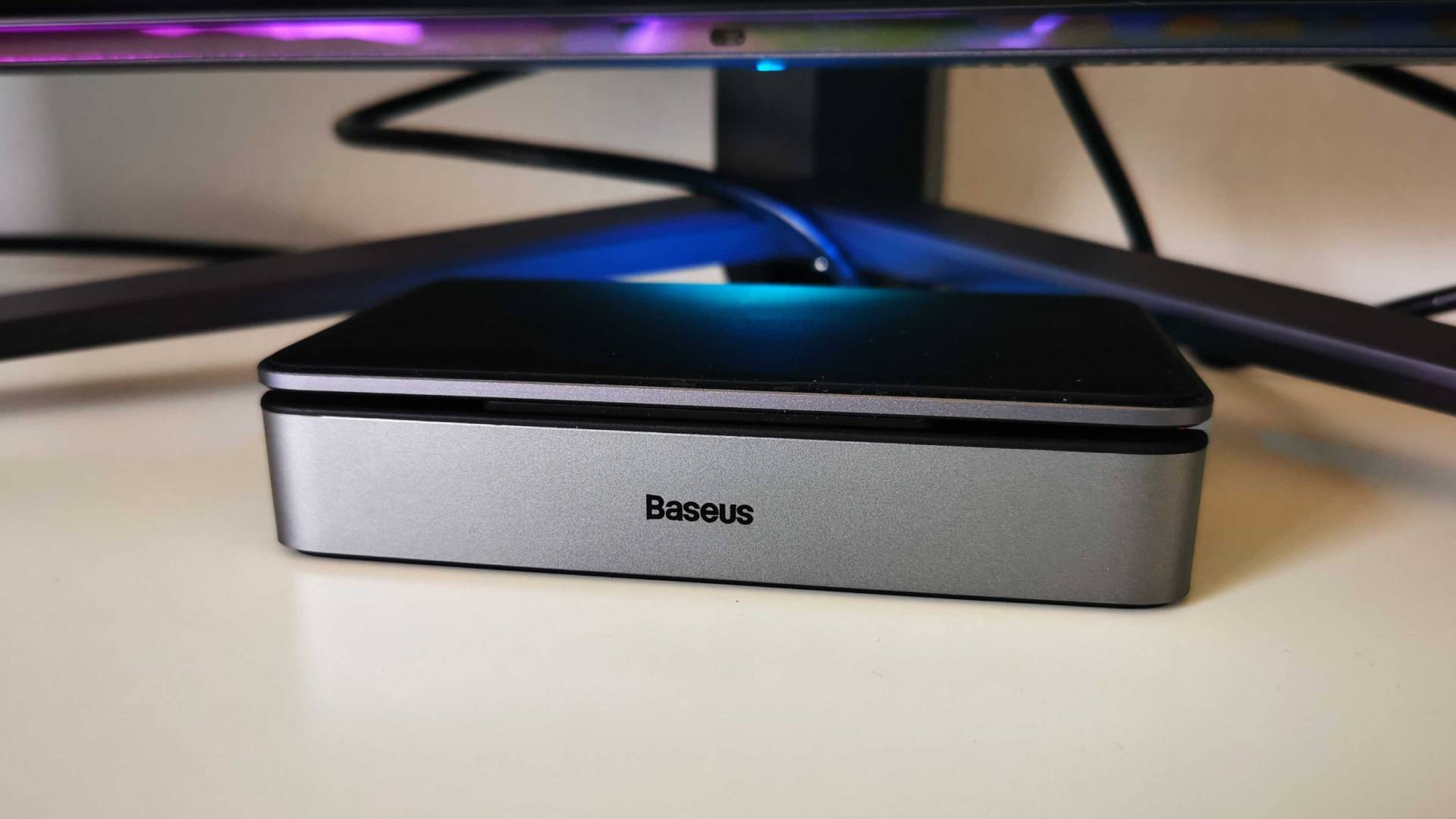 Baseus docking station sitting on white desk