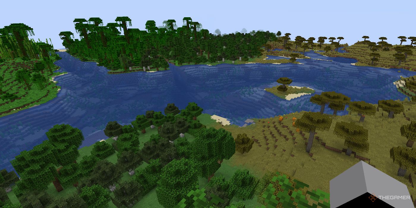 A visible border between a savanna and a forest appears in Minecraft.