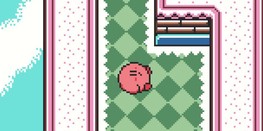 Kirby rolling down a green path in Kirby Tilt N Tumble.