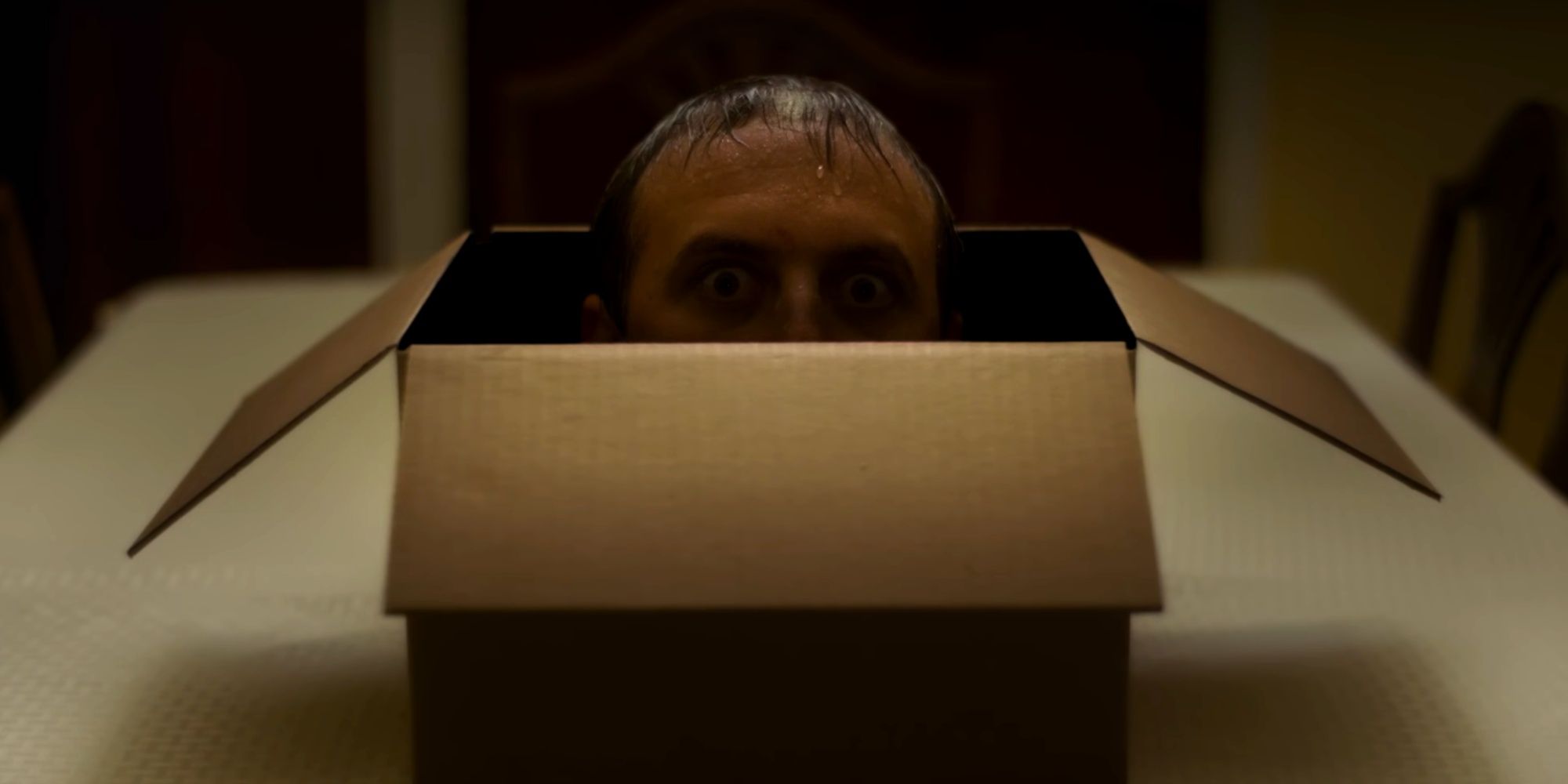 The Other Side of the Box (short film) - man in box