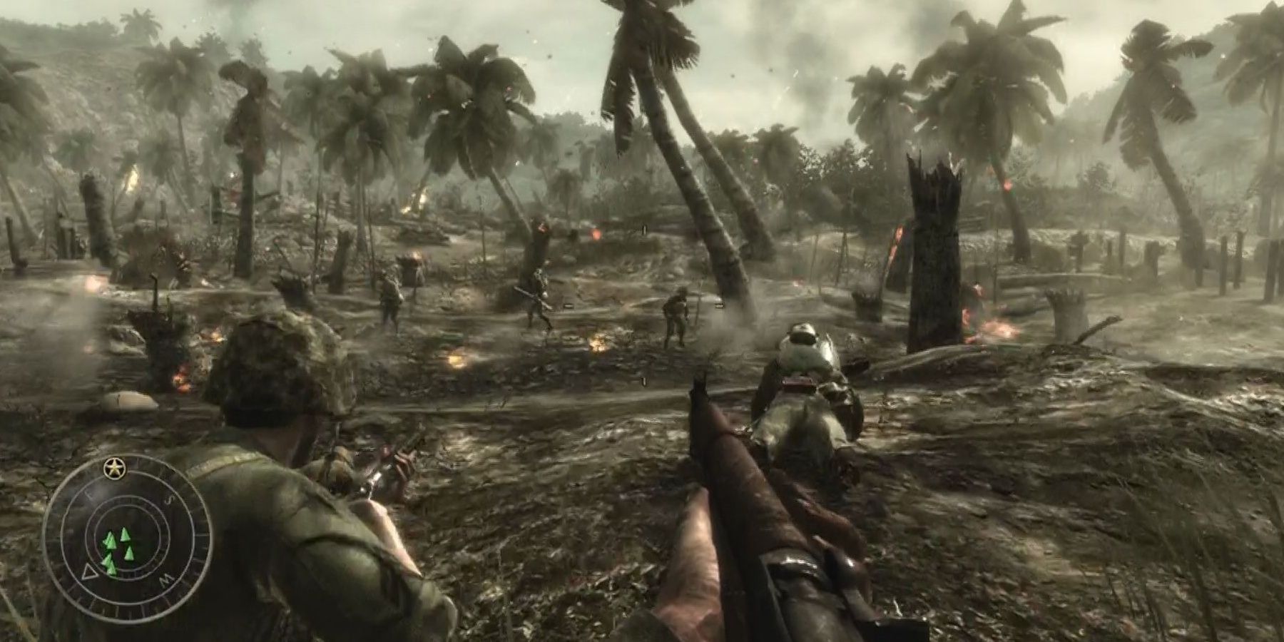 a burning battlefield with palm trees in Call of Duty World at War