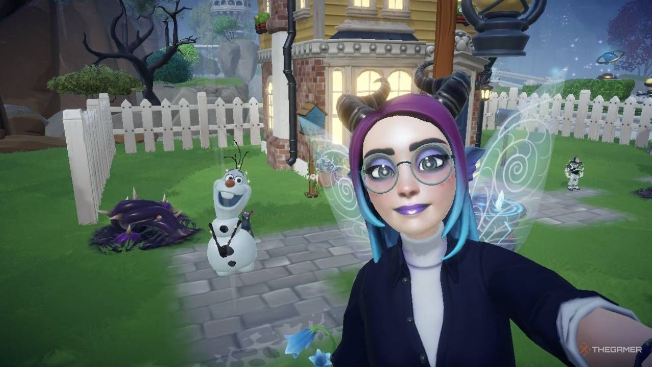 Disney Dreamlight Valley avatar taking a selfie with Olaf on the left side of the image. The avatar's house and white picket fence can be seen in the background.