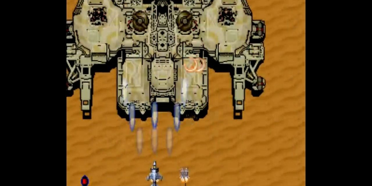 Shooting at the big boss in Aero Fighters.